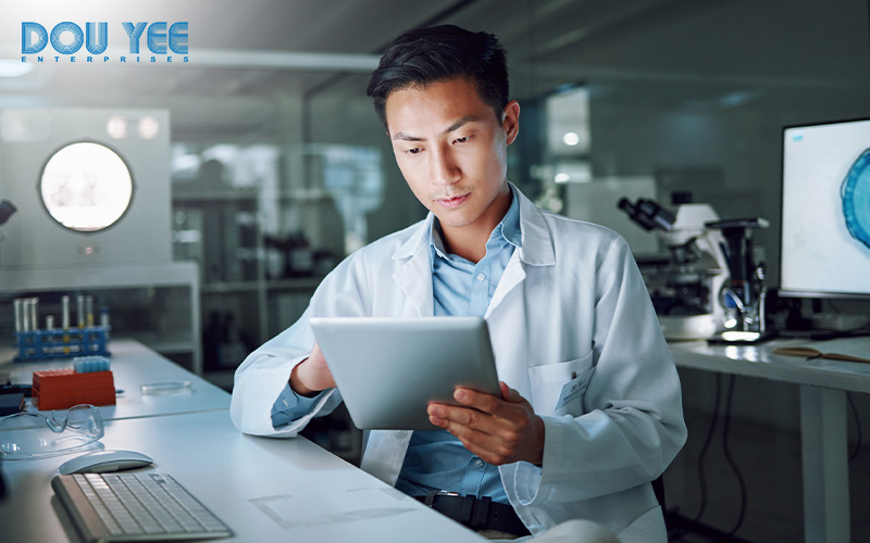 Researcher using a tablet to manage laboratory information.